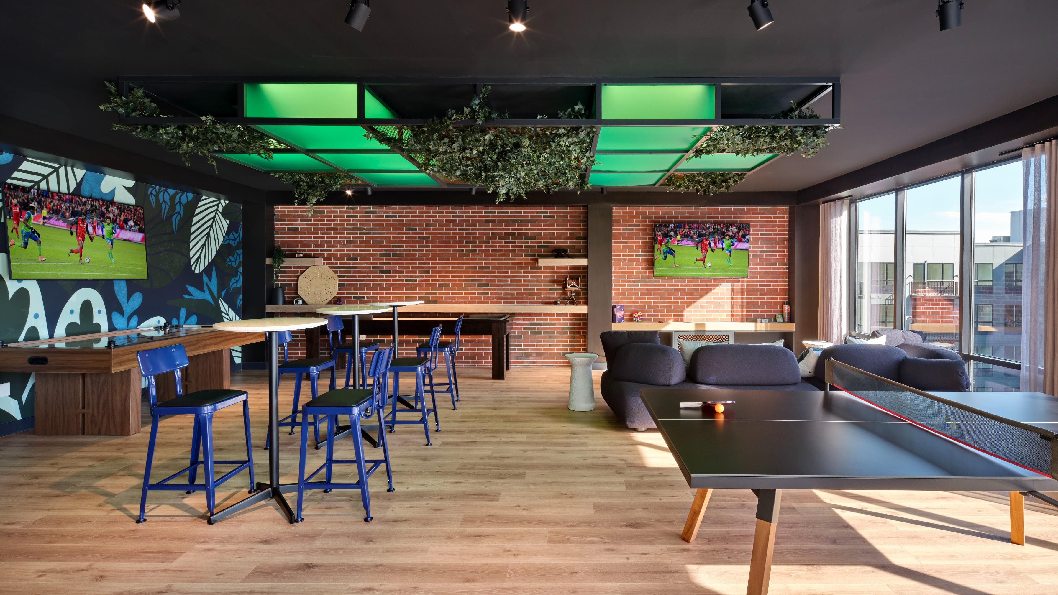 Game room with shuffleboard and ping pong table